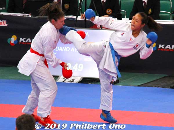 Women karateka competing.