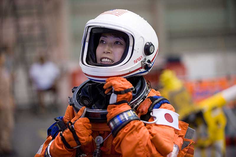 17 Sept. 2009 --- Naoko Yamazaki dons a training version of her shuttle launch and entry suit in preparation for a water survival training session...
17 Sept. 2009 --- Japan Aerospace Exploration Agency (JAXA) astronaut Naoko Yamazaki, STS-131 mission specialist, dons a training version of her shuttle launch and entry suit in preparation for a water survival training session in the waters of the Neutral Buoyancy Laboratory (NBL) near NASA's Johnson Space Center.
