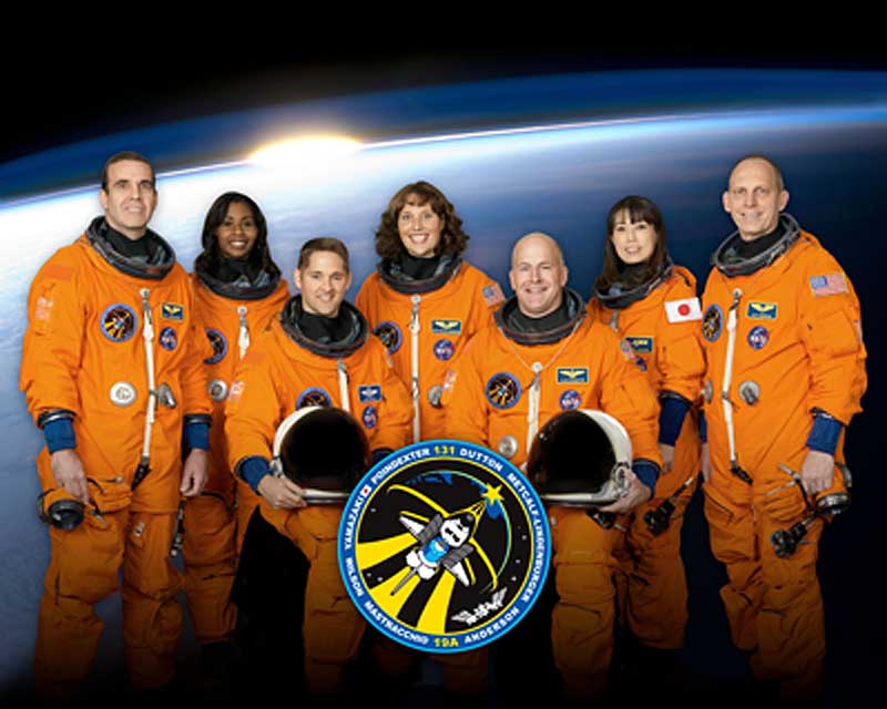 21 Oct. 2009 --- Attired in training versions of their shuttle launch and entry suits, these seven astronauts take a break from training to pose for the STS-131 crew portrait.
21 Oct. 2009 --- Attired in training versions of their shuttle launch and entry suits, these seven astronauts take a break from training to pose for the STS-131 crew portrait. Seated are NASA astronauts Alan Poindexter (right), commander; and James P. Dutton Jr., pilot. Pictured from the left (standing) are NASA astronauts Rick Mastracchio, Stephanie Wilson, Dorothy Metcalf-Lindenburger, Japan Aerospace Exploration Agency (JAXA) astronaut Naoko Yamazaki and NASA astronaut Clayton Anderson, all mission specialists.
