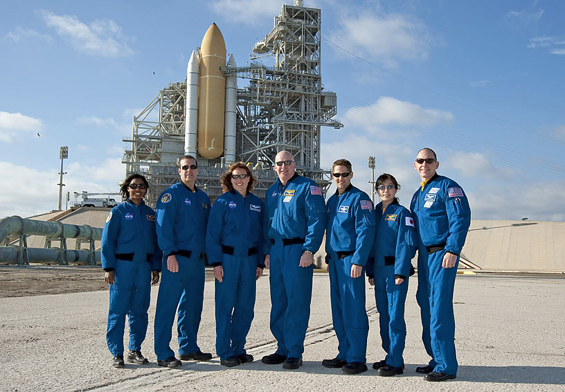 2010 March 4-- Crew poses in front of the launch pad before the start of the Terminal Countdown Demonstration Test, a simulation of the final hours of a launch countdown.
