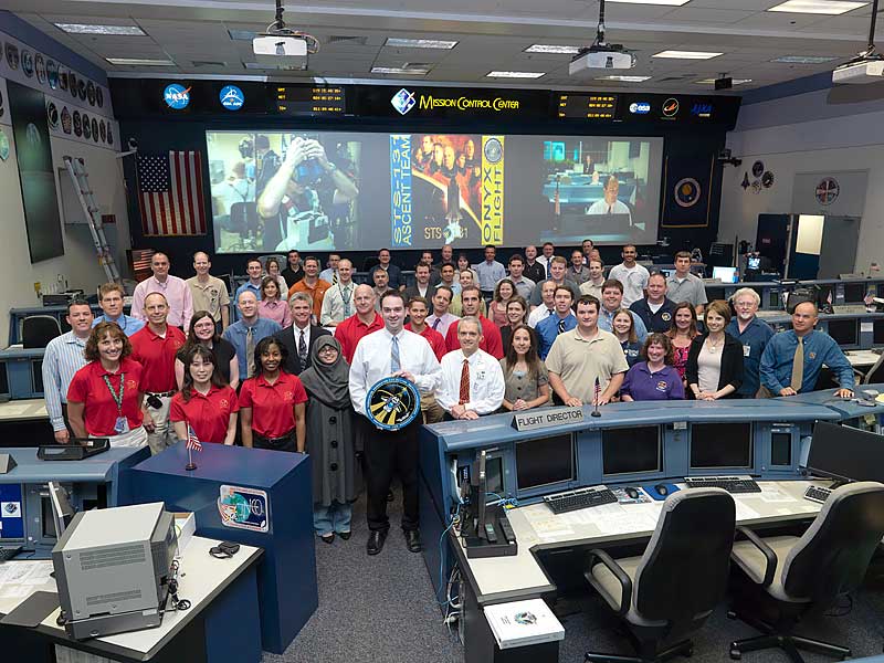 29 April 2010 --- Members of the STS-131 Ascent flight control team and crew members pose for a group portrait in the space shuttle flight control room in the Mission Control Center...
29 April 2010 --- The members of the STS-131 Ascent flight control team and crew members pose for a group portrait in the space shuttle flight control room in the Mission Control Center at NASA's Johnson Space Center. Flight director Bryan Lunney and NASA astronaut Alan Poindexter, commander, (left center) stand on the second row. Additional crew members pictured are NASA astronauts James P. Dutton Jr., pilot; Clayton Anderson, Dorothy Metcalf-Lindenburger, Stephanie Wilson, Rick Mastracchio and Japan Aerospace Exploration Agency (JAXA) astronaut Naoko Yamazaki, all mission specialists.
