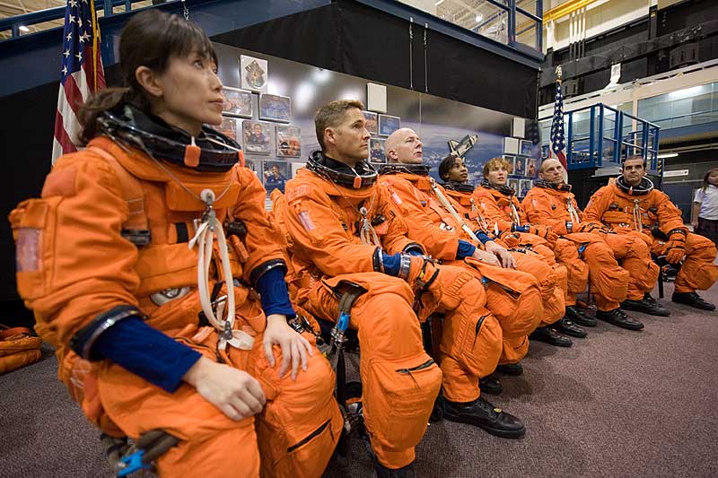 14 Sept. 2009 --- Attired in training versions of their shuttle launch and entry suits, the STS-131 crew members await the start of a training session in the Space Vehicle Mock-up Facility at Johnson Space Center.
14 Sept. 2009 --- Attired in training versions of their shuttle launch and entry suits, the STS-131 crew members await the start of a training session in the Space Vehicle Mock-up Facility at NASA's Johnson Space Center. Pictured from the left are Japan Aerospace Exploration Agency (JAXA) astronaut Naoko Yamazaki, mission specialist; NASA astronauts James P. Dutton Jr., pilot; Alan Poindexter, commander; Stephanie Wilson, Dorothy Metcalf-Lindenburger, Clay Anderson and Rick Mastracchio, all mission specialists.
