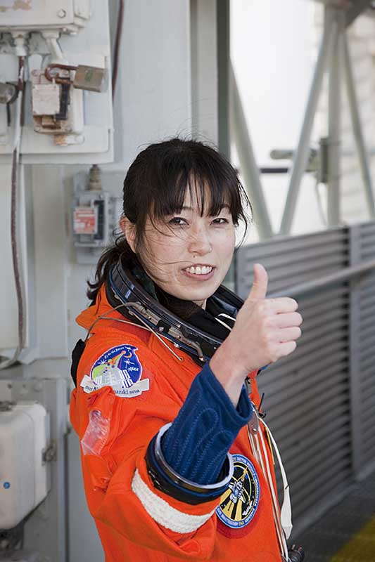 2010 March 5 --- Naoko gives the thumbs up as she heads for Space Shuttle Discovery for the Terminal Countdown Demonstration Test.
