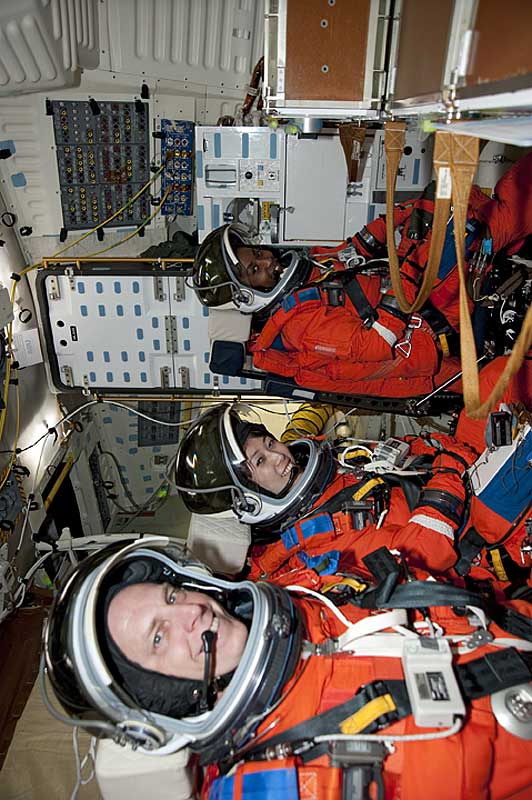 2010 March 5 --- During the Terminal Countdown Demonstration Test, the crew sit in Space Shuttle Discovery for a countdown simulation. In the middle is Naoko.
