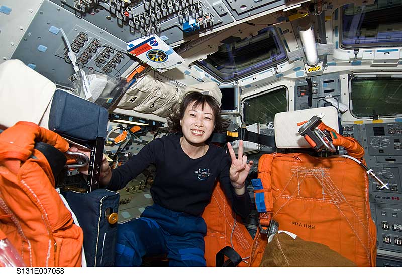 5 April 2010 --- Naoko Yamazaki flashes the peace sign on the flight deck of space shuttle Discovery during postlaunch activities.
5 April 2010 --- Japan Aerospace Exploration Agency (JAXA) astronaut Naoko Yamazaki, STS-131 mission specialist, is pictured on the flight deck of space shuttle Discovery during postlaunch activities.
