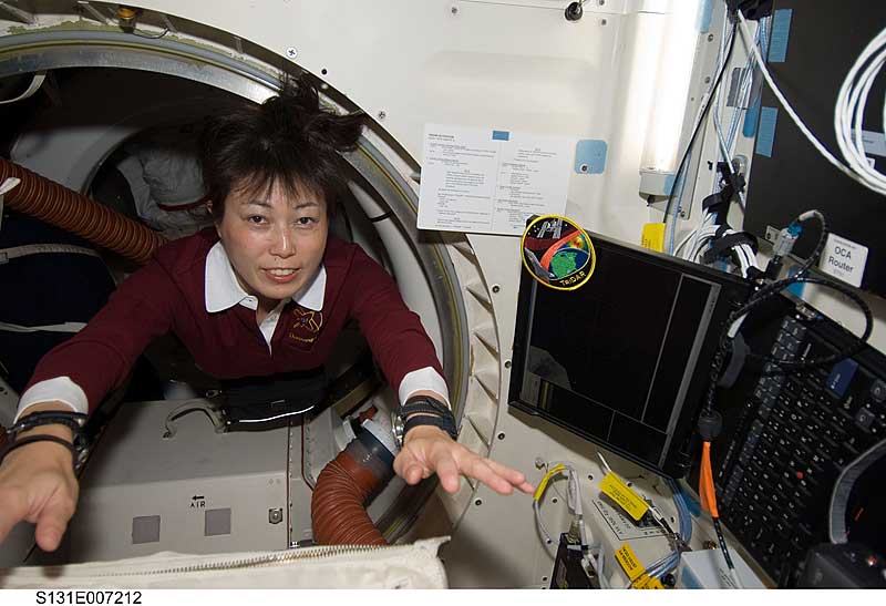 6 April 2010 --- Naoko Yamazaki floats through a hatch on the middeck of space shuttle Discovery during flight day three activities.
6 April 2010 --- Japan Aerospace Exploration Agency (JAXA) astronaut Naoko Yamazaki, STS-131 mission specialist, floats through a hatch on the middeck of space shuttle Discovery during flight day three activities.
