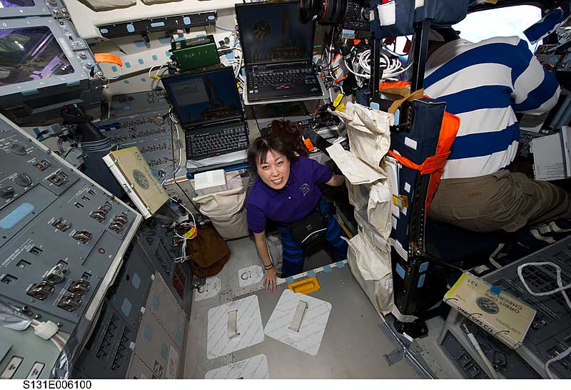 6 April 2010 --- Naoko Yamazaki is in the hatch which connects the flight deck and middeck of space shuttle Discovery during flight day two activities.
6 April 2010 --- Japan Aerospace Exploration Agency (JAXA) astronaut Naoko Yamazaki, STS-131 mission specialist, is pictured in the hatch which connects the flight deck and middeck of space shuttle Discovery during flight day two activities. NASA astronaut Alan Poindexter, commander, is at right.

