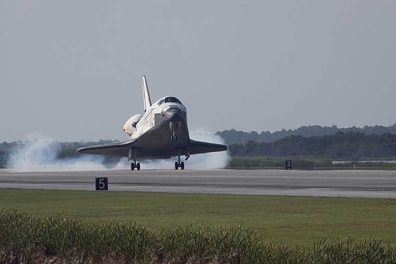 Space shuttle Discovery lands on Runway 33 at the Shuttle Landing Facility at NASA's Kennedy Space Center in Florida at 9:08 a.m. (EDT) on April 20, 2010.
20 April 2010 --- Space shuttle Discovery lands on Runway 33 at the Shuttle Landing Facility at NASA's Kennedy Space Center in Florida at 9:08 a.m. (EDT) on April 20, 2010, completing the 15-day STS-131 mission to the International Space Station. Main gear touchdown was at 9:08:35 a.m. followed by nose gear touchdown at 9:08:47 a.m. and wheels stop at 9:09:33 a.m. Aboard are NASA astronauts Alan Poindexter, commander; James P. Dutton Jr., pilot; Dorothy Metcalf-Lindenburger, Rick Mastracchio, Stephanie Wilson, Clayton Anderson and Japanese astronaut Naoko Yamazaki, all mission specialists. The seven-member STS-131 crew carried the Leonardo Multi-Purpose Logistics Module, filled with supplies, a new crew sleeping quarters and science racks that were transferred to the station's laboratories. The crew also switched out a gyroscope on the station's truss, installed a spare ammonia storage tank and retrieved a Japanese experiment from the station's exterior. STS-131 is the 33rd shuttle mission to the station and the 131st shuttle mission overall.
