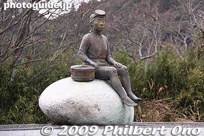 Statue of an [url=http://photojpn.org/books/theme/iwase.html]ama woman diver[/url] sitting on a rock on the Onjuku Station train platform. These women dived deep in the ocean (without scuba gear) from small boats to harvest shellfish and other seafood.
Keywords: chiba onjuku-machi beach japansculpture