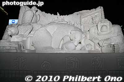 "Zoo of the Northland" sculpture lit up at night. 
Keywords: hokkaido sapporo snow festival ice sculptures 
