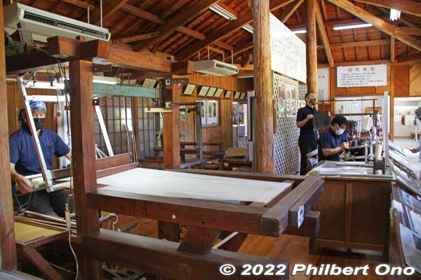 Inside the Oshima (Ooshima) Tsumugimura fabric factory. A few workers demonstrated the production of tsumugi silk fabric. This weaving step is called shimebata to make patterns on the silk.
Keywords: kagoshima Amami Oshima tsumugi silk fabric textile factory