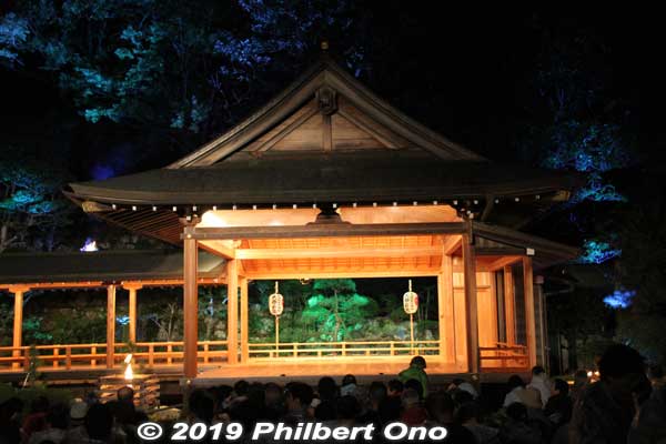 The Noh tradition on Oyama was disrupted due to the Great Kanto Earthquake in 1923 and World War II, but it was resurrected in the 1980s.
The background trees were also beautifully illuminated. Also notice the small torches. Starting at 4 pm, four plays including a dance and kyogen were performed. Ended at 7:30 pm. They also had a beautiful bilingual (Japanese and English) program explaining much about the Oyama, Afuri Shrine, and Noh.
Keywords: kanagawa isehara oyama takigi noh