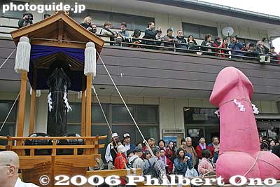 Two of the portable shrines ready to go. In Japanese, the festival is nicknamed "Chinko Matsuri" (Phallus Festival) ちんこ祭り.
There are three portable shrines (called mikoshi). The Kanamara mikoshi (the original portable shrine), Kanamara-bune mikoshi (shaped like a boat), and Elizabeth mikoshi (pink giant). All three are carried during a procession around town. The Elizabeth mikoshi is carried by she-males. ("New half" in Japanese. Go ahead and laugh if you want.)
Keywords: kanagawa kawasaki kanayama jinja shrine phallus penis kanamara matsuri japanshrine festival