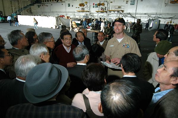 Kitty Hawk tours are often conducted to increase public awareness about the ship’s mission and her crew.
Yokosuka, Japan (April 14, 2006) - USS Kitty Hawk (CV 63) Public Affairs Officer, Lt. Cmdr. Terry Dudley, provides an informational ship tour about to Japanese dignitaries. Kitty Hawk tours are often conducted to increase public awareness about the ship’s mission and her crew. Currently in port conducting repairs and maintenance during a ship's restricted availability period, Kitty Hawk demonstrates power projection and sea control as the U.S. Navy's only permanently forward-deployed aircraft carrier, operating from Yokosuka, Japan. U.S. Navy photo by Photographer's Mate Airman Adam York (RELEASED)
