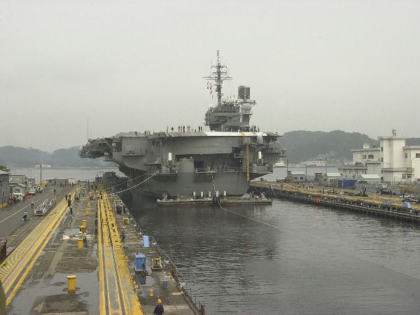Yokosuka, Japan (May 20, 2003) -- USS Kitty Hawk (CV 63) is moved into dry dock at Fleet Activities Yokosuka for scheduled maintenance.
Yokosuka, Japan (May 20, 2003) -- USS Kitty Hawk (CV 63) is moved into dry dock at Fleet Activities Yokosuka for scheduled maintenance. The carrier recently returned from operations with coalition forces in support of Operation Iraqi Freedom, the Persian Gulf during Operation Iraqi Freedom, the multi-national coalition effort to liberate the Iraqi people, eliminate Iraq's weapons of mass destruction, and end the regime of Saddam Hussein. U.S. Navy photo by Photographer’s Mate Airman Jacob Taylor. (RELEASED)
