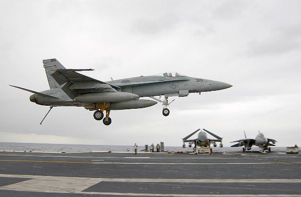 At sea with USS Kitty Hawk (CV 63) Jan. 24, 2003 -- An F/A-18C “Hornet,” with its tailhook down, attempts a controlled landing on the ship’s flight deck.
At sea with USS Kitty Hawk (CV 63) Jan. 24, 2003 -- An F/A-18C “Hornet,” with its tailhook down, attempts a controlled landing on the ship’s flight deck. Kitty Hawk is the Navy’s only permanently forward-deployed aircraft carrier and operates out of Yokosuka, Japan. U.S. Navy photo by Photographer’s Mate 3rd Class Todd Frantom. (RELEASED)
