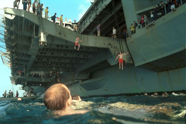At sea aboard USS Kitty Hawk (CV 63) November 27, 2001 – After 58 days of sustained round the clock combat operations, crewmembers let off some steam and enjoy a “swim-call” during a break in flight operations.
At sea aboard USS Kitty Hawk (CV 63) November 27, 2001 – After 58 days of sustained round the clock combat operations, crewmembers let off some steam and enjoy a “swim-call” during a break in flight operations. Kitty Hawk and her embarked Carrier Air Wing Five (CVW-5) are conducting missions in support of Operation Enduring Freedom. Kitty Hawk operates out of Yokosuka, Japan, as America's only permanently forward-deployed aircraft carrier. U.S. Navy Photo by Photographer's Mate 3rd Class Christopher S. Borgren II (Released)
