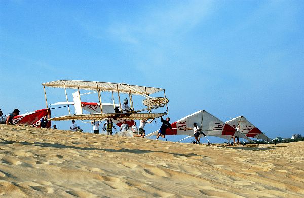Jockey's Ridge State Park, N.C. (Oct. 3, 2002) -- Lt. Cmdr. Klas "Santa" Ohman, from aboard USS Kitty Hawk (CV 63), completes a flight in a replica of the 1902 Wright brothers' glider.
Jockey's Ridge State Park, N.C. (Oct. 3, 2002) -- Lt. Cmdr. Klas "Santa" Ohman, from aboard USS Kitty Hawk (CV 63), completes a flight in a replica of the 1902 Wright brothers' glider. Ohman, one of only three military pilots with the honor to fly the aircraft, will do so during the commemorative event "Return to Kitty Hawk," scheduled for the first weekend in October. The 1902 Wright glider was the first aircraft incorporating yaw, pitch, and roll controls, and considered by most aviation historians to be a significant milestone in aviation history. USS Kitty Hawk is the United States' only permanently forward deployed aircraft carrier, operating out of Yokosuka, Japan. The replica is built by the Wright Brothers' Aeroplane Company, an educational organization established to further the interests of young people in aviation careers. U.S. Navy photo by Photographer's Mate 1st Class Shane T. McCoy. (RELEASED)
