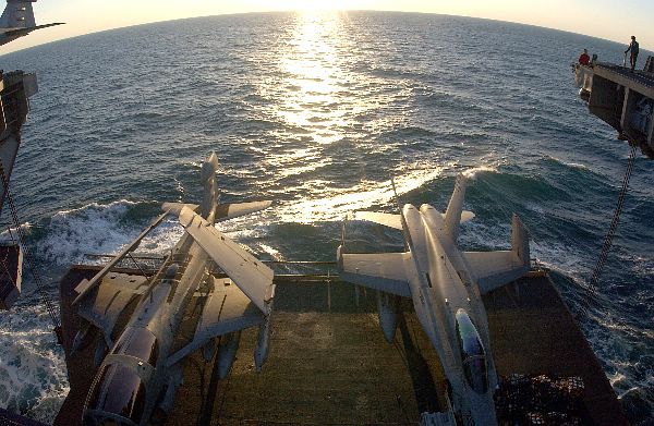 Arabian Gulf (Feb. 28, 2003) -- An EA-6B “Prowler” (left) and an F/A-18C “Hornet” (right) are raised to the flight deck on one of four aircraft elevators aboard USS Kitty Hawk (CV 63).
Arabian Gulf (Feb. 28, 2003) -- An EA-6B “Prowler” (left) and an F/A-18C “Hornet” (right) are raised to the flight deck on one of four aircraft elevators aboard USS Kitty Hawk (CV 63). Kitty Hawk and Carrier Air Wing Five (CVW-5) are conducting missions in support of Operation Southern Watch. Approaching 42 years of distinguished service, Kitty Hawk is America’s oldest active commissioned vessel and is the Navy’s only permanently forward-deployed aircraft carrier operating from Yokosuka, Japan. Kitty Hawk is in the 5th Fleet area of operations in support of coalition forces in that region. U.S. Navy photo by Photographer’s Mate 3rd Class Todd Frantom. (RELEASED)
