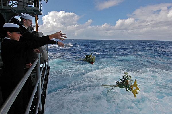 CORAL SEA (July 26, 2007) - Yeoman Seaman Jessica Gardner and Yeoman Seaman Whitney Utter throw flowers overboard as USS Kitty Hawk (CV 63) passes the final resting place of USS Lexington.
CORAL SEA (July 26, 2007) - Yeoman Seaman Jessica Gardner and Yeoman Seaman Whitney Utter throw flowers overboard as USS Kitty Hawk (CV 63) passes the final resting place of USS Lexington (CV 2). The ship passed the spot where 216 Lexington Sailors lost their lives after their ship on was attacked by Japanese forces on May 8, 1942, during the battle of Coral Sea. Kitty Hawk is two months into her summer deployment from Fleet Activities Yokosuka, Japan. U.S. Navy photo by Mass Communication Specialist Seaman Kyle D. Gahlau (RELEASED)
