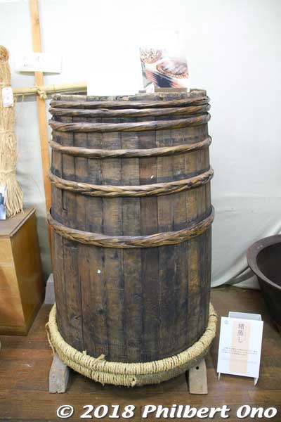 To make the paper fibers for washi, there are many laborious steps. After the kozo branches are cut in even lengths, they are stuffed in a barrel (koshiki) like this and placed over a boiling and steaming iron pot for three to four hours 
to soften the brown bark.
Keywords: kyoto ayabe Kurotani washi paper making