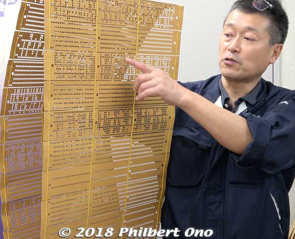 Tayuh Kigyo's third-generation company president Tamoi Hayato (田茂井 勇人) first explained about their chirimen manufacturing process.
These looping punch cards called "mon-gami" (紋紙) program the Jacquard loom to weave the design on the fabric. The holes in the punch cards tell the loom which threads are to be raised or not during the weaving process. These punch cards can be made by computer now.
Keywords: kyoto kyotango tango peninsula chirimen silk crepe fabric material textile