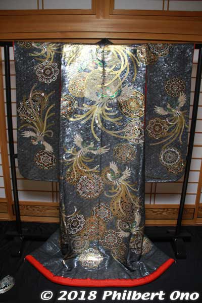 Tamiya Raden (民谷螺鈿) had this stunning silk kimono on display for us. "Raden" means inlay (using shell, ivory, etc.). 
Typically, we think of lacquerware, but they do it on fabrics. This kimono took 2.5 years to make and is worth more than a Lamborghini or Rolls Royce.
Keywords: kyoto kyotango tango peninsula chirimen silk crepe fabric material textile tamiya raden kimono