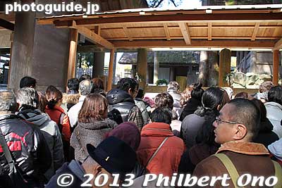 There was a money box under both the thatched roof and under the slim roof structure next to it. Either way, you can still pray at the shrine. Not a big deal if you don't go through the torii or don't pray from the center spot under the thatched
It really looked like the people going up on the right edge were exiting without praying at the shrine. Not so. They could also pray at the shrine, but at an off-center position. 
Keywords: mie ise jingu shrine shinto hatsumode new year&#039;s day shogatsu worshippers