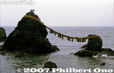 Wedded Rocks with a new rope. Japan has numerous other Wedded Rocks and stones, but this is by far the most famous.
Keywords: mie ise futami-cho meoto iwa wedded rocks shimenawa rope ocean okitama shrine matsuri festival