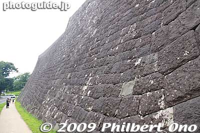 Climb further and you'll reach large stone walls, called the Honmaru northern stone wall. 
Keywords: miyagi sendai castle 