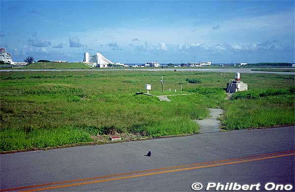 Runway at the old Ishigaki Airport. The slanty white building visible is the ANA hotel on the beach. That's how close the old airport was to town.
Keywords: okinawa old Ishigaki Airport