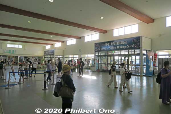 Inside the Ishigaki Port terminal building. One big hallway with doors to the boat docks and ticket windows and tour agency counters.
Keywords: okinawa Ishigaki Port