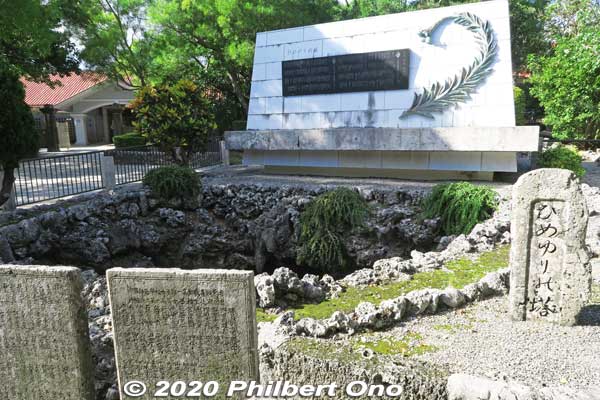 Himeyuri Cenotaph (white) and older monuments. Seen on the left is the Himeyuri Peace Museum. 第三外科壕
Keywords: okinawa itoman himeyuri war monument