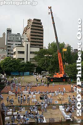 A large crane is used to carry the portable shrines onto the boats.
Keywords: osaka tenjin matsuri festival procession boats river