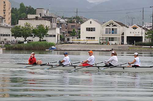 Rowing past the rowing club of Ryukoku University, based in Kyoto.
