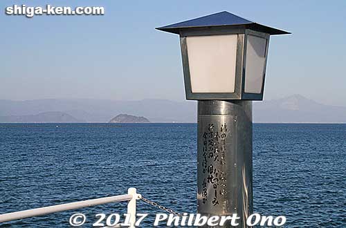 [color=blue][b]Verse 3 Song Monument, Imazu[/b][/color]. A lantern, at the end of the pier at Imazu Port. 三番の歌碑。今津港の桟橋。夜に赤く点灯。
This is at the end of Imazu Pier. At night, this lamp lights up in red. You can see Chikubushima island and Mt. Ibuki in the background.
Keywords: shiga takashima imazu lake biwa rowing song biwako shuko no uta monument