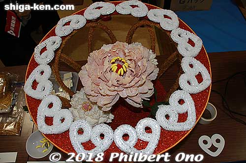 This is the base for the dog. All edible materials. Notice the flower's yellow stamen in the center.
Keywords: shiga omi-hachiman sagicho matsuri festival float 2018 dog