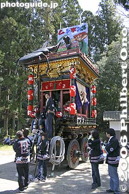 Float named Man'ensha. Built in 1860 (Man’en 1). 萬延社
Constructed in 1860 (Man’en 1). For the first 70 years since its construction, the wood used in this hikiyama was unfinished; but to commemorate the enthronement of Emperor Showa, in 1929 (Showa 4) a black lacquer finish as well as gold leaf and decorative metalwork was added.

Keywords: shiga hino-cho matsuri festival float