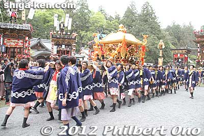 The first of three portable shrines leave the shrine in a procession for the Otabisho resting place across town.
