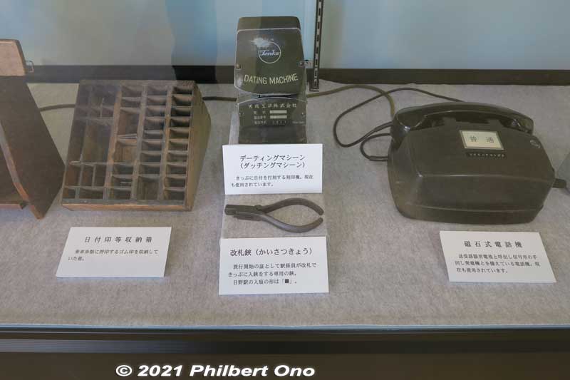 L-R: Holder for rubber date stamps used to stamp the date on the ticket. Dating machine to imprint the date on the ticket. Clippers to cutout a small square on the ticket when boarding the train. Magneto telephone with a crank.
Keywords: shiga hino station Ohmi Railways omi Museum