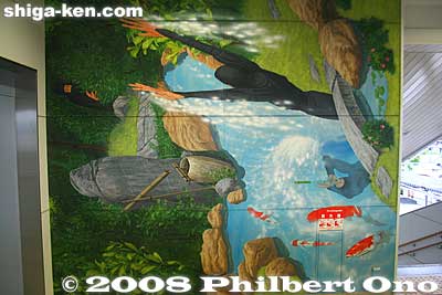 Wall mural sideways, showing ninja and a river.
Keywords: shiga koka station train ninja paintings