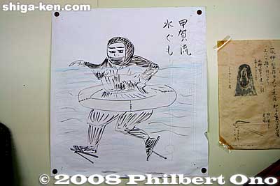 Water spider (mizugumo): How the ninja did it. This drawing from the Koka Ninja House shows how it was done. The ninja sat on the board inside the wooden ring and waded through the water while partially submerged. His wooden clogs had small flippers.
Keywords: shiga koka koga ninja village house ninjutsu