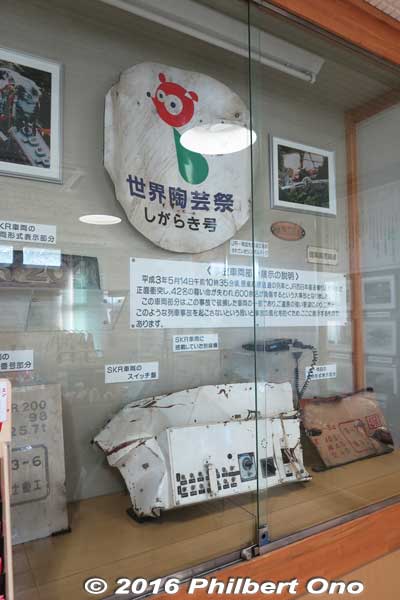 Display case in the corner shows a few pieces from the wrecked train in the 1991 accident.
On the morning of May 14, 1991, a Shigaraki Kogen Railway train bound for Kibukawa collided head on with a special JR West train traveling from Kyoto to Shigaraki. It left 42 people, including five SKR employees, dead and 614 injured. Also see photos below of the monument near the accident site.
Keywords: shiga koka shigaraki train station