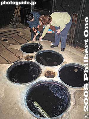 Then we go to the indigo vats. They are heated with charcoal made with wood from trees on their hill. Each vat has a different indigo density.
Keywords: shiga konan indigo dyeing fabrics textiles blue shigabestbunka