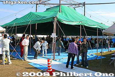 The sumo arena was under a large tent. The ground was covered by a blue, vinyl tarp.
Keywords: shiga maibara sumo exhibition tournament wrestlers rikishi ozumo maibarasumo