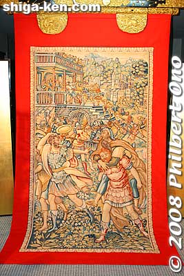 Tapestry designated as an Important Cultural Property. The Trojan War's Sack of Troy (from Greek mythology) is depicted. From the Gekkyuden-zan float.
Keywords: shiga otsu matsuri festival floats