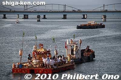 The fireworks barge can be seen on the distance.
Keywords: shiga otsu setagawa river senkosai mikoshi matsuri festival portable shrine boats 
