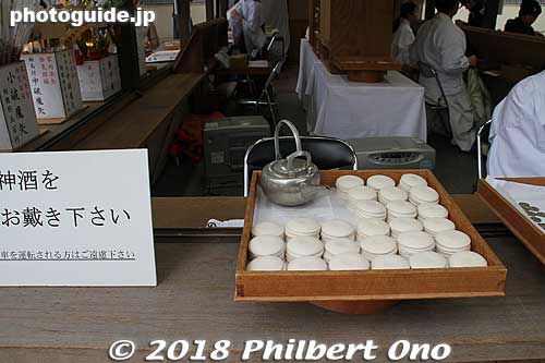 Small dishes for a sip of sake if you give a small donation. They also had this in front of the Honden. 
Keywords: shimane Izumo Taisha Shrine