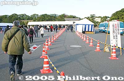 Bag checkpoint ahead. They inspected all our bags. Note that they do not allow any drinks (not even water) to be taken into the palace. You will have to dump it in the trash can they provide.
Keywords: Tokyo Chiyoda-ku ward emperor akihito birthday Imperial Palace