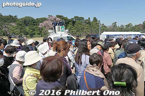 Policeman was shouting that people with no bags to be checked can go through a different (faster) line.
Keywords: tokyo chiyoda-ku imperial palace